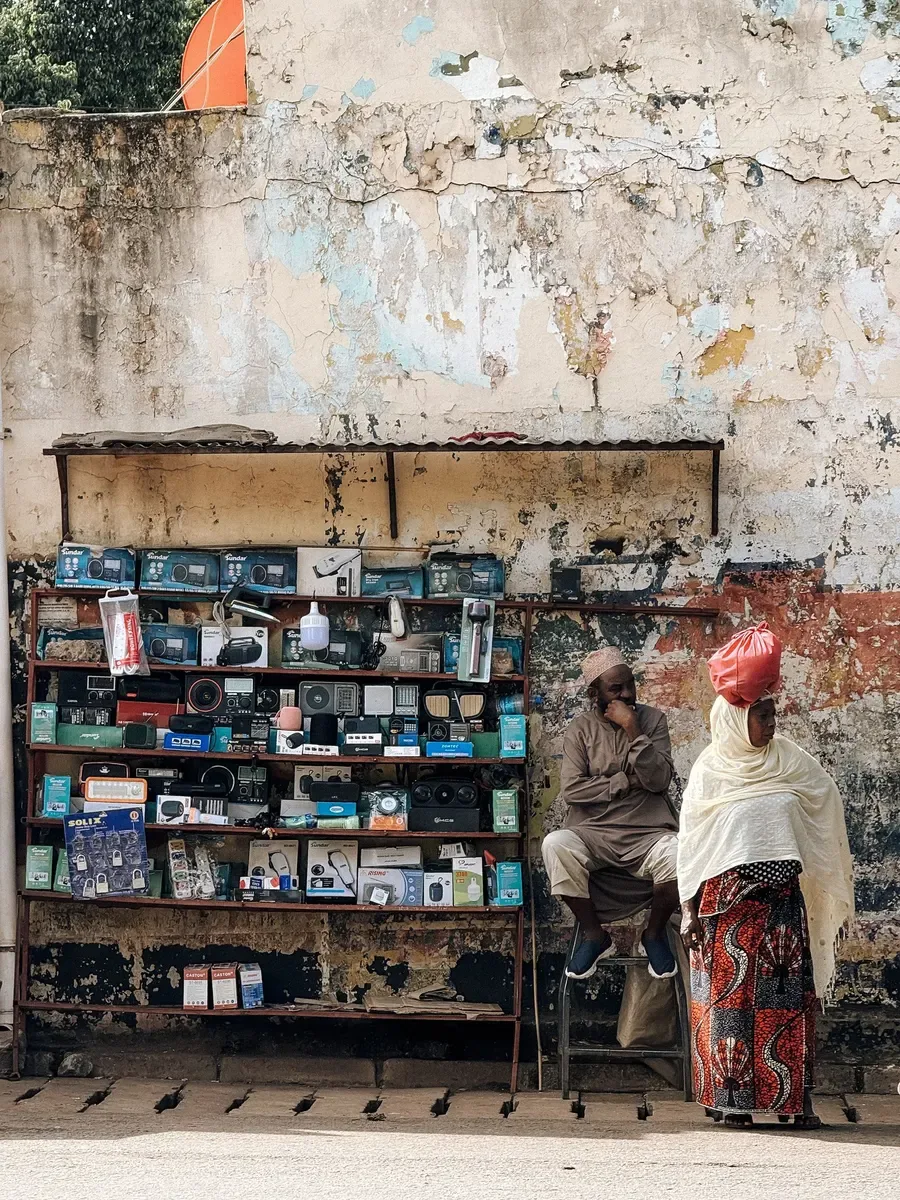 Phones, chargers and accessories on the shelves outside the shop (sample photo)