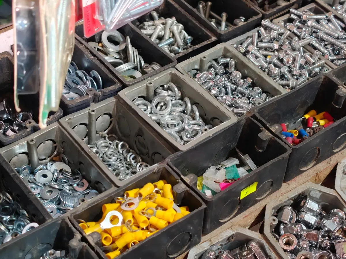 Bolts, nuts and fittings sorted in trays (sample photo)